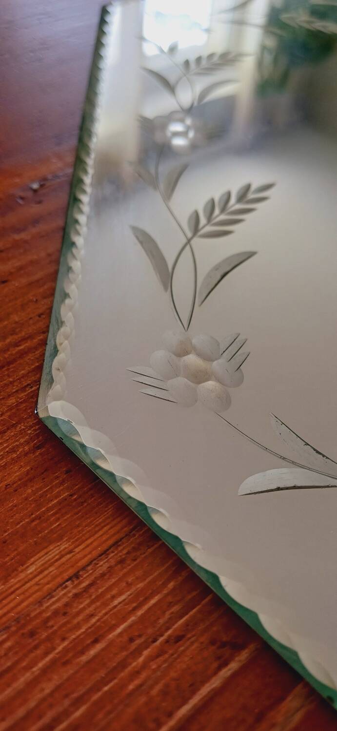 Beveled mirror with floral decor
