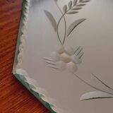 Beveled mirror with floral decor