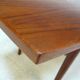 Curved Danish teak coffee table with additional shelf compartment, 1960s