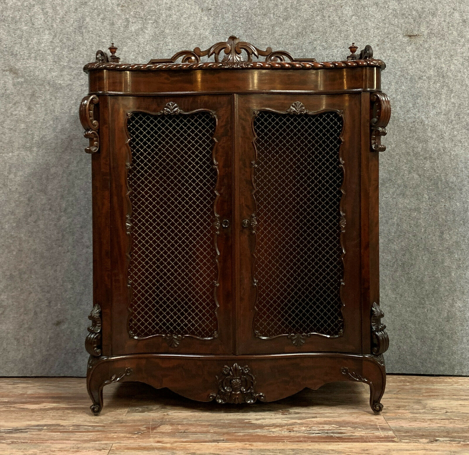 Exceptional furniture for this Napoleon III period living room library in curved mahogany shape