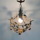 Patinated metal ceiling light with a floral and leaf pattern, 1950s, Italy.
