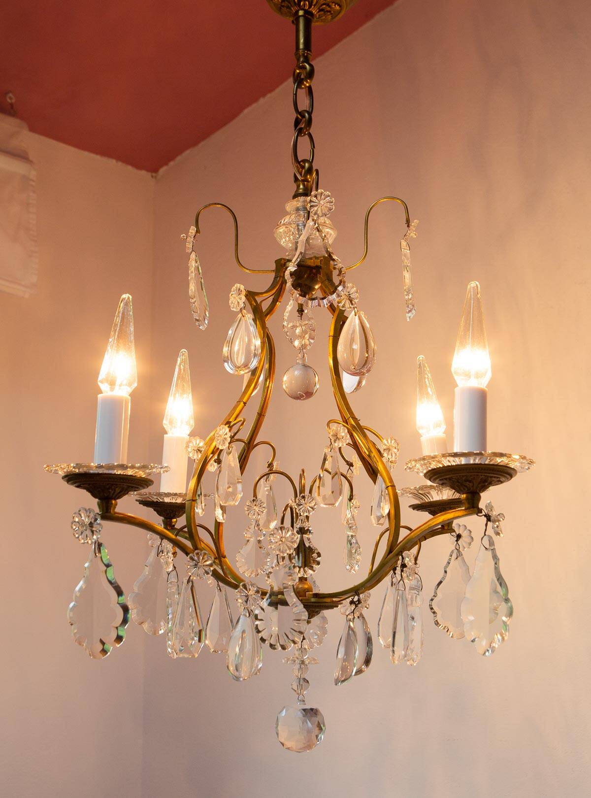 Old French chandelier in gilded brass with tassels