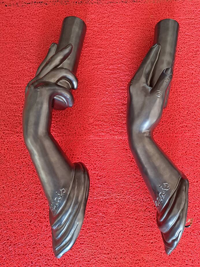 Pair of sculptural ceramic wall lights by Jean Marais