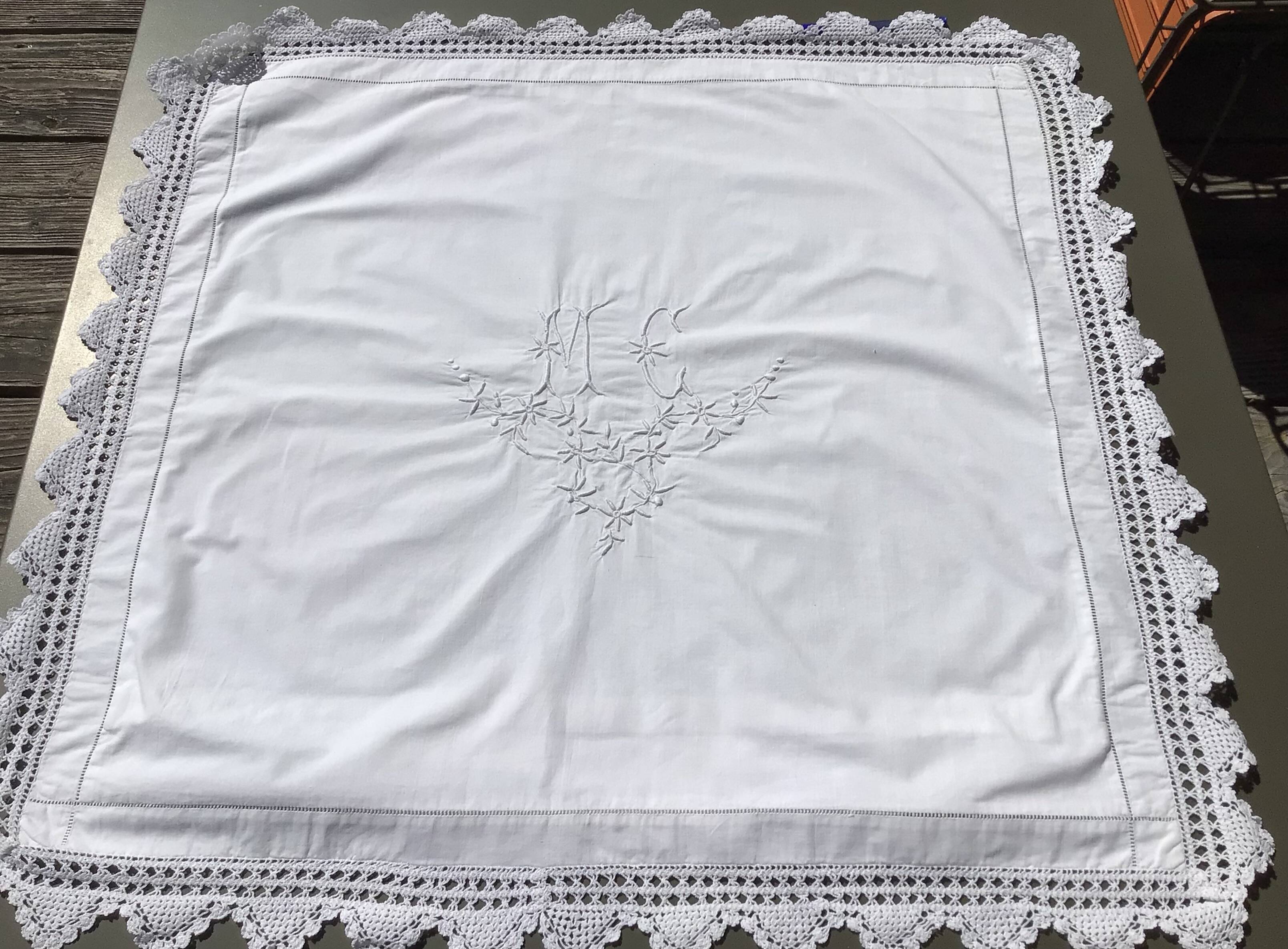 MC embroidered pillowcase with flower detailing and crocheted edge