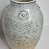 Stoneware vase signed by Sylvie Dufour, incised decoration and relief medallions, 28 cm.