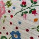 Cushion in hand-embroidered hemp.