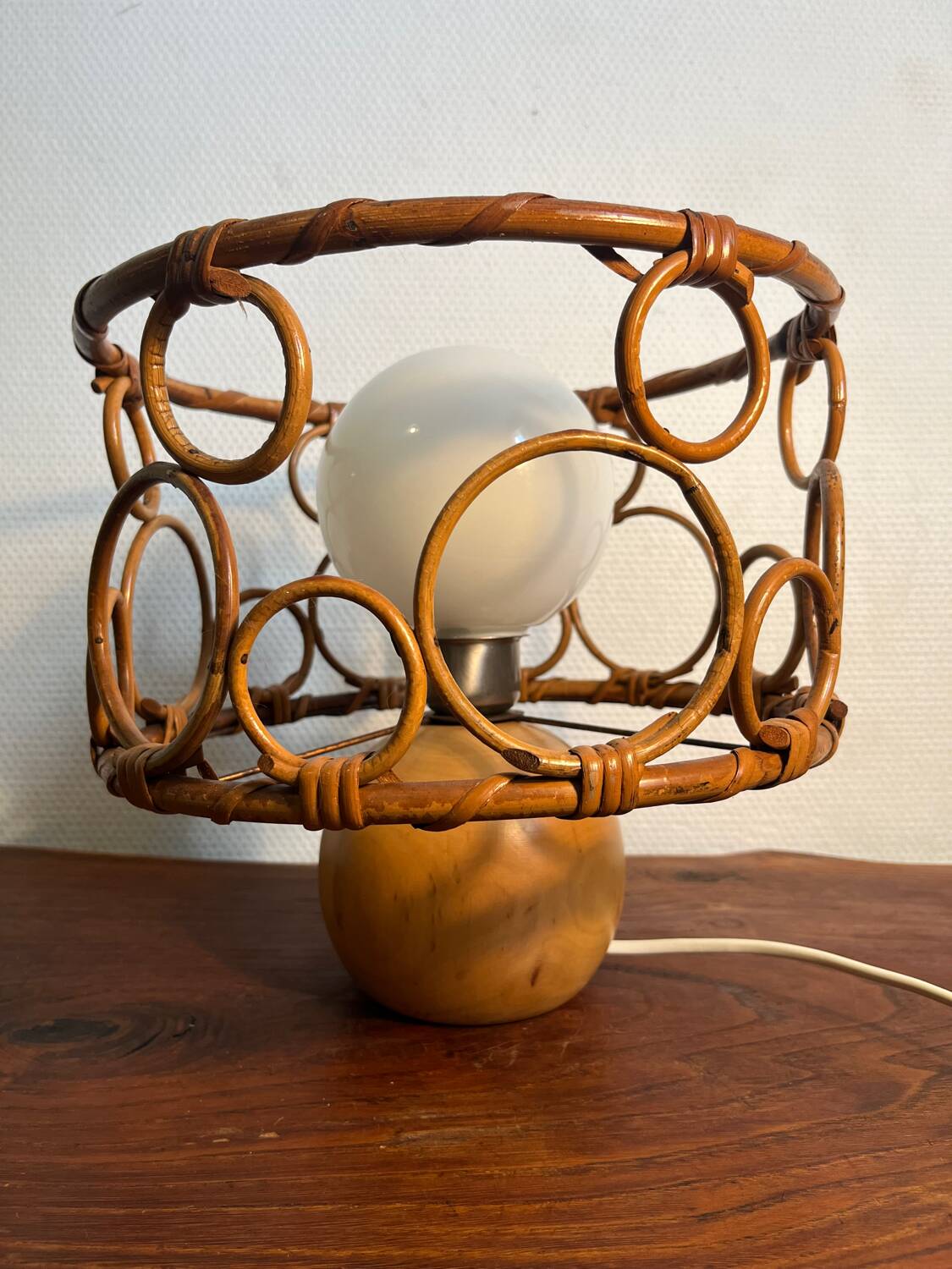 Solid wood table lamp with opaline wicker globe