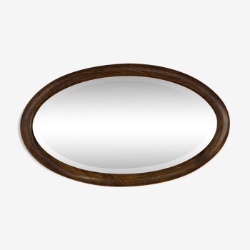 Oval wooden and stucco wall mirror