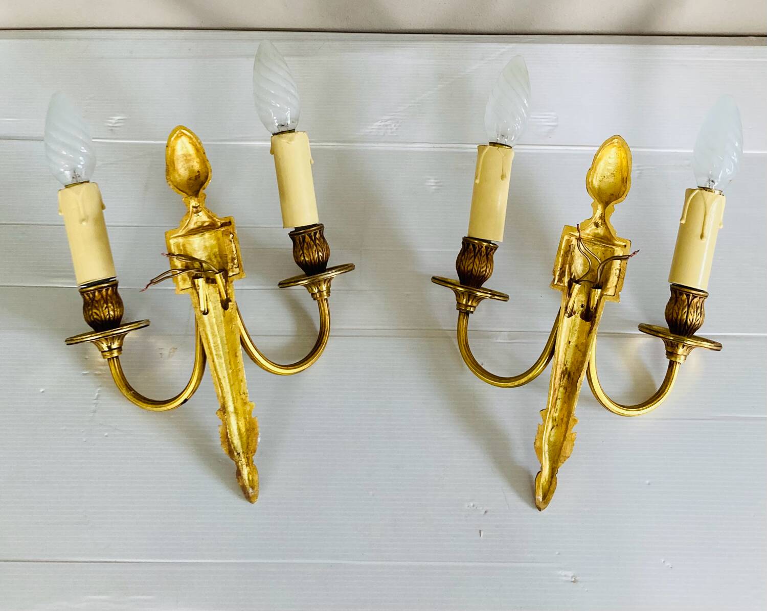 St Louis XVI gilded bronze wall lights with foliage and pine cone decorations