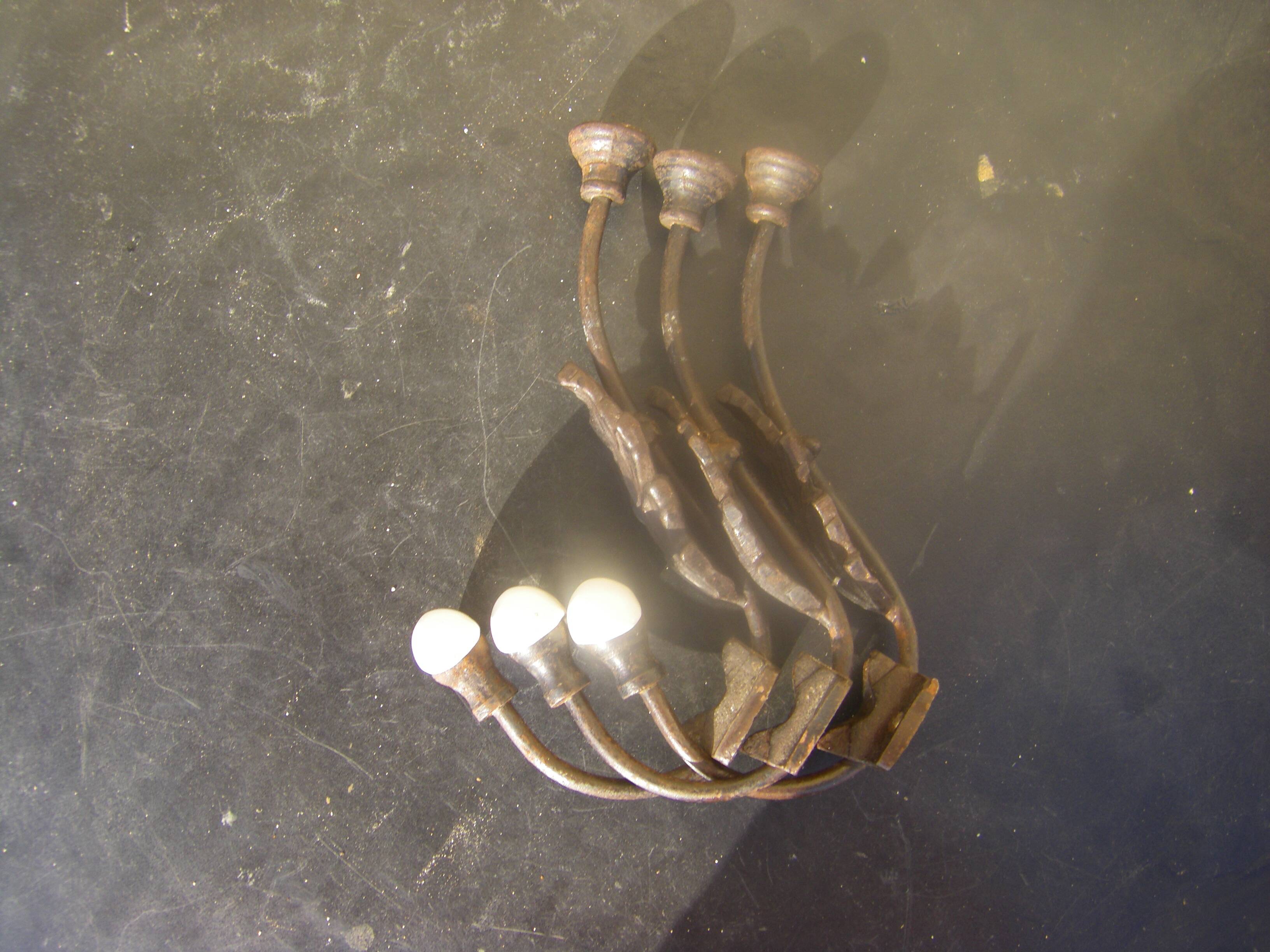 Trio of vintage coat hooks.