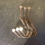 Trio of vintage coat hooks.