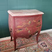 French XIX jumping chest of drawers in Chinese lacquer ox and golden blood