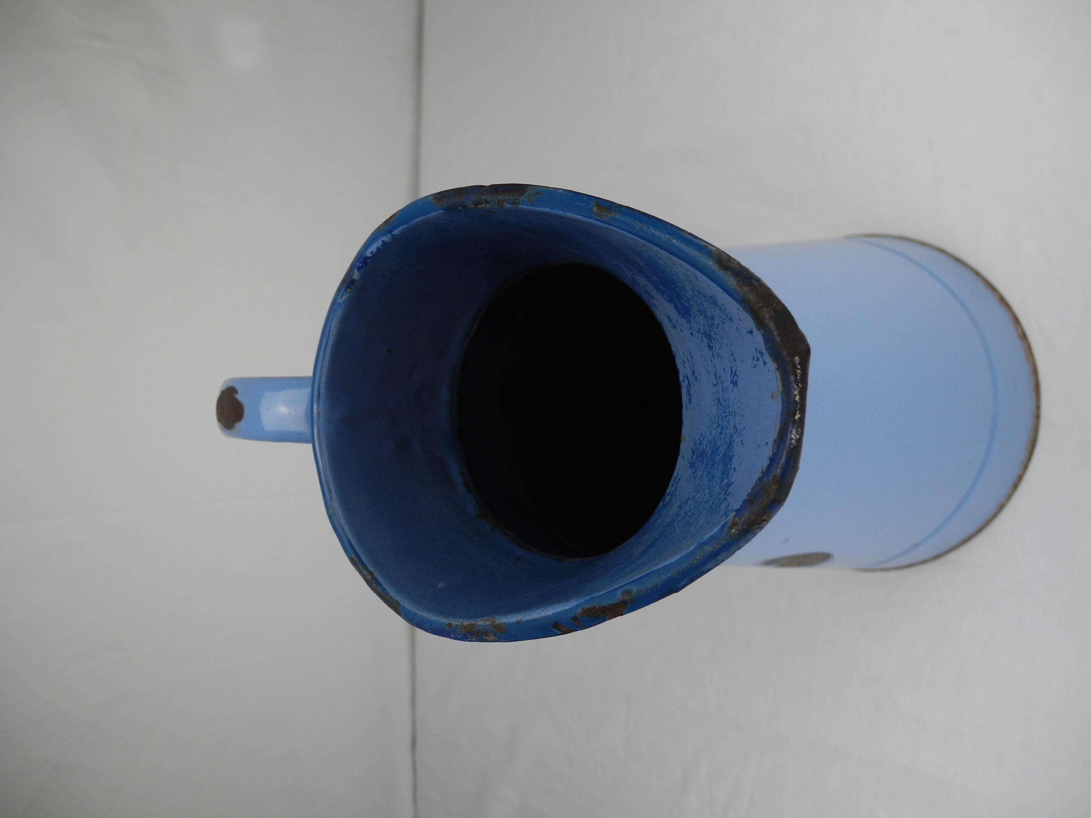 Old vintage enamelled sheet metal jug