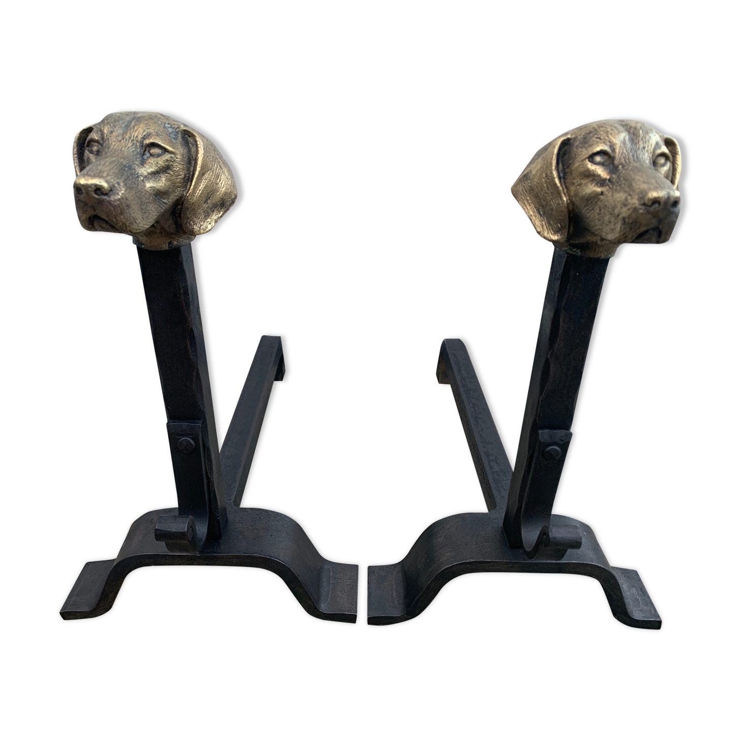 Pair of metal chenets decorated with brass dog heads