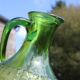 Antique vintage pitcher in green molded glass with floral relief - retro decoration