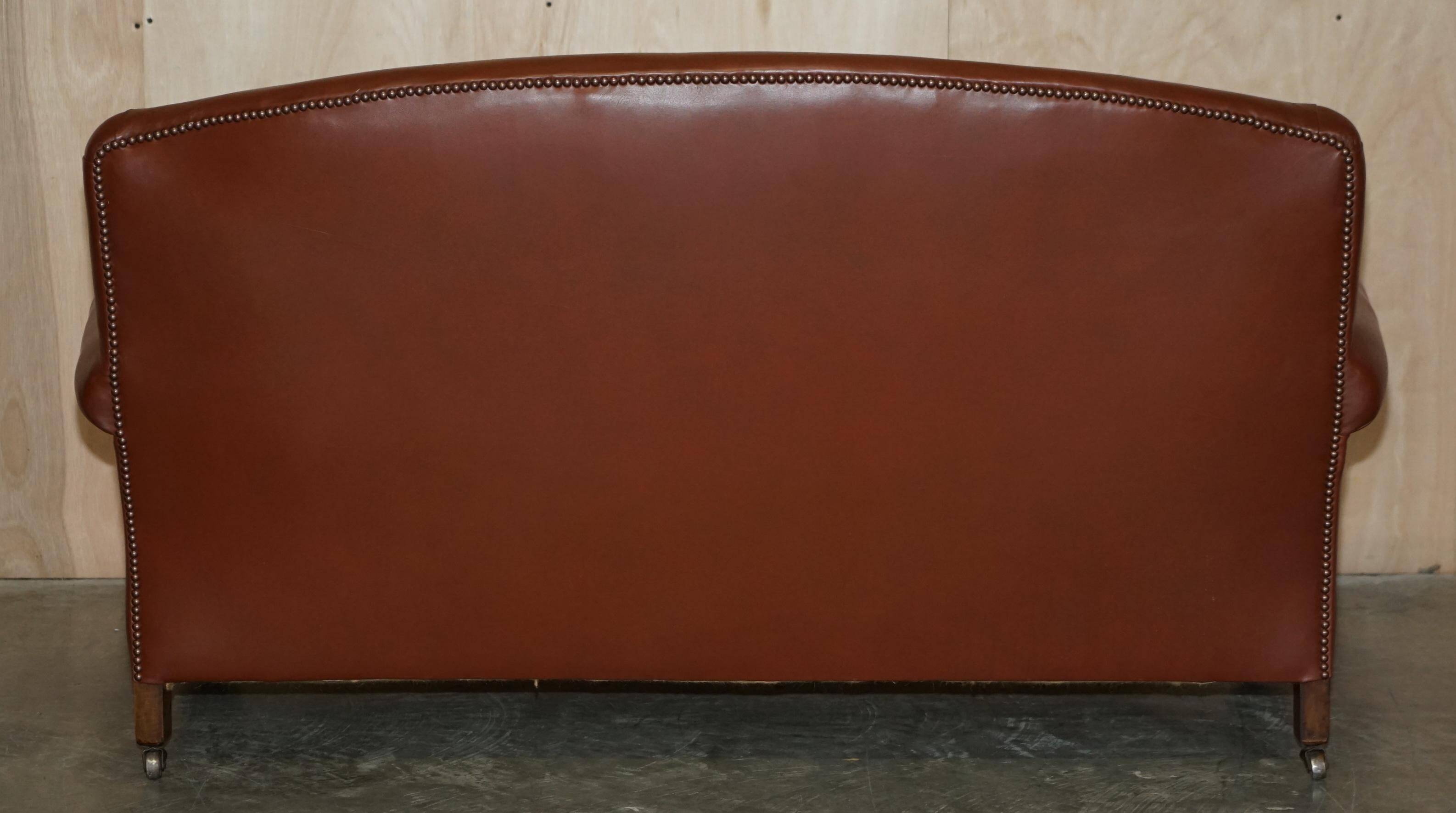 Edwardian leather club canapé circa 1910 with feather cushions.