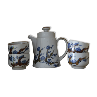 teapot and its stoneware tea cups with a Japanese pattern