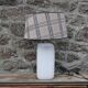 White ceramic lamp with tartan shade – cozy and timeless style