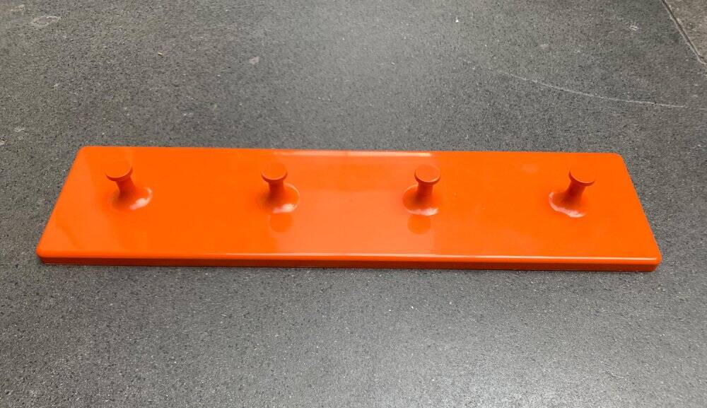 Orange coat rack from the mid-century space age, 1960s.