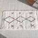 Brown and white Berber Béni Ouarain rug with diamonds in wool