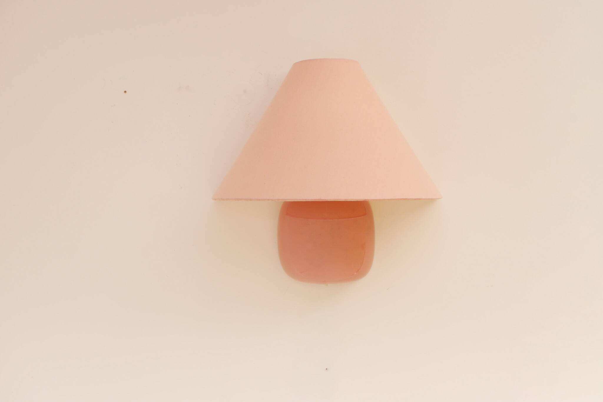 Vintage IKEA 80s sconce. A wall mounted lamp classic semi-round in pink