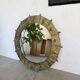 Brutalist round hammered gold metal mirror