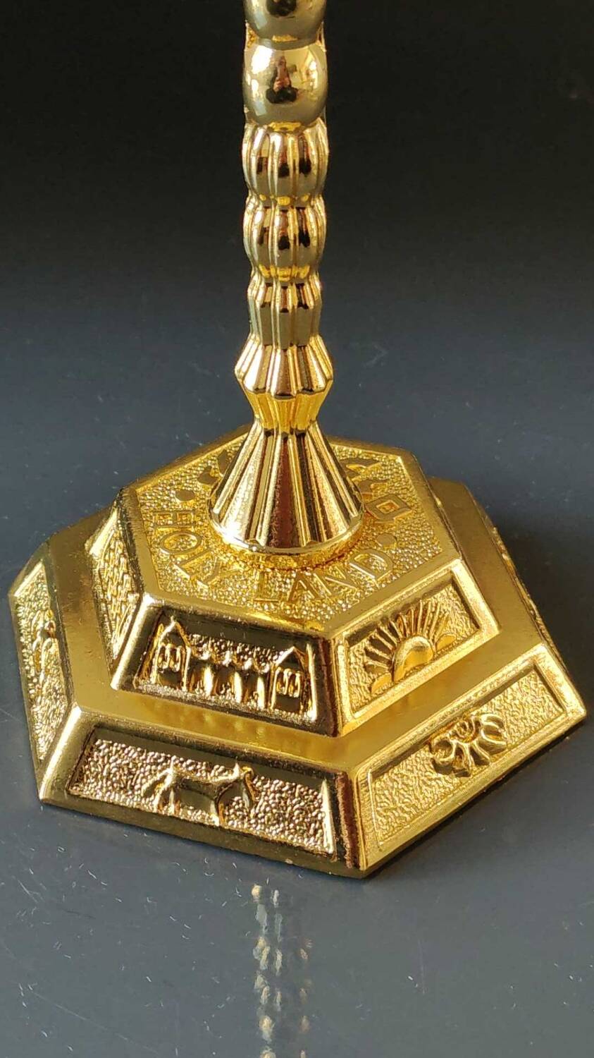 Menorah/Jewish/Hebrew candlestick with 7 arms of light. Engraved with the symbols of the 12 tribes of Israel/Holyland inscription. In gold metal. Size 20 x 16 cm