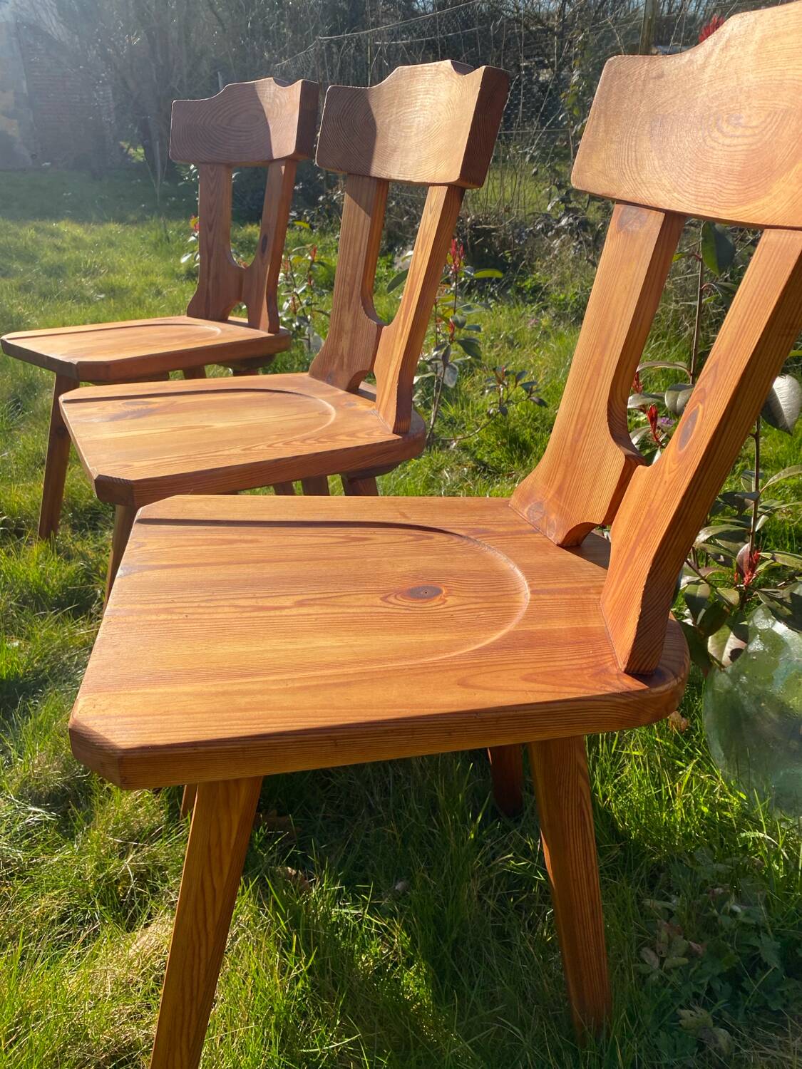 Three solid wood chairs