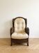 Fauteuil vintage en rotin et osier avec coussin beige