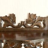 Carved wooden wall shelf