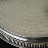 Silver-plated trivet.