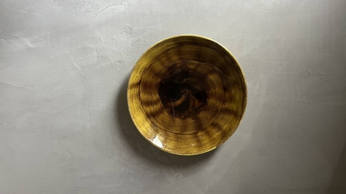 Yellow ceramic plate by Georges Jouve