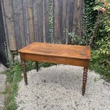 Old kitchen table with chopping board.