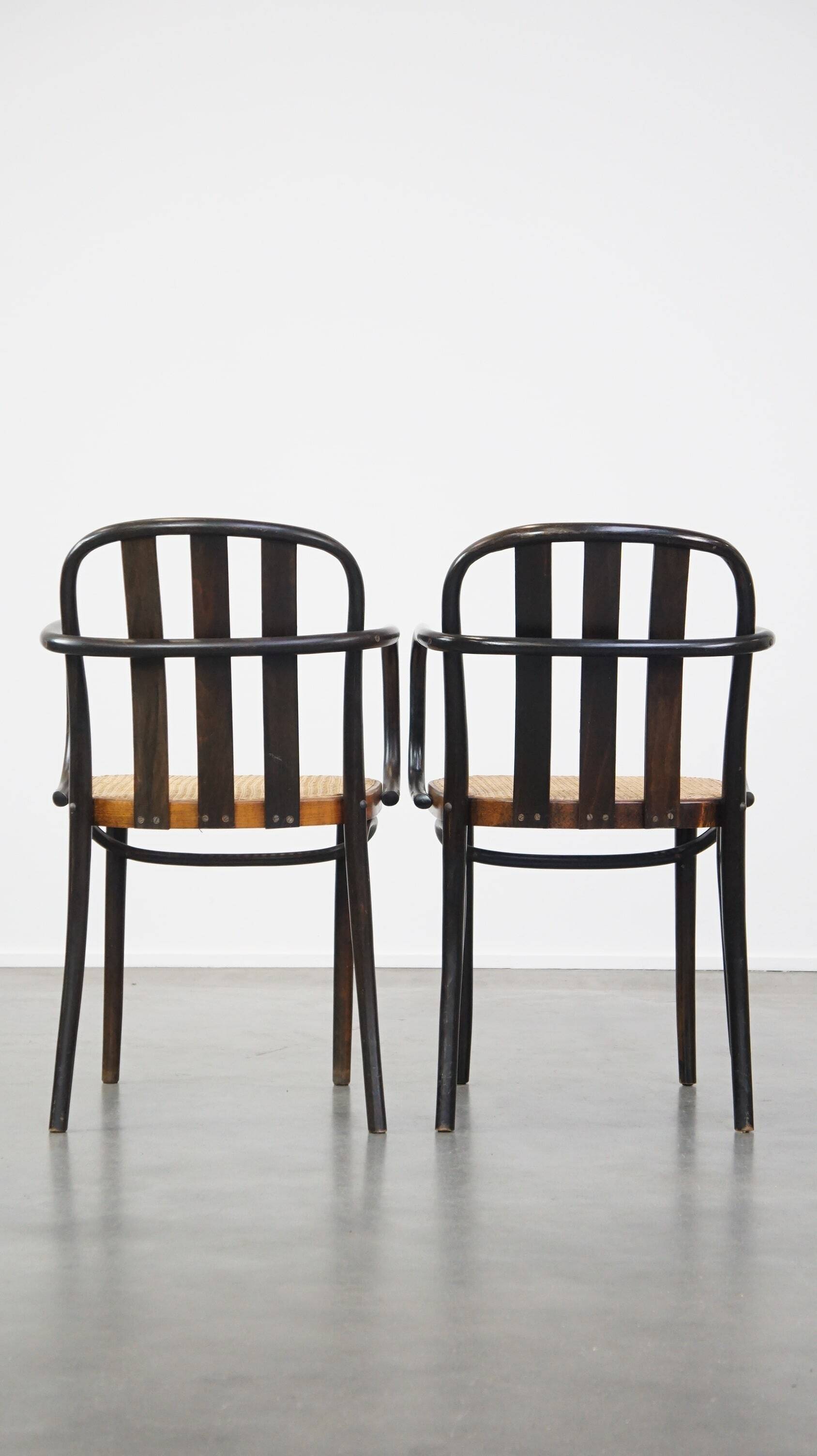 Set of 2 vintage wooden design dining/bistro chairs with woven seats