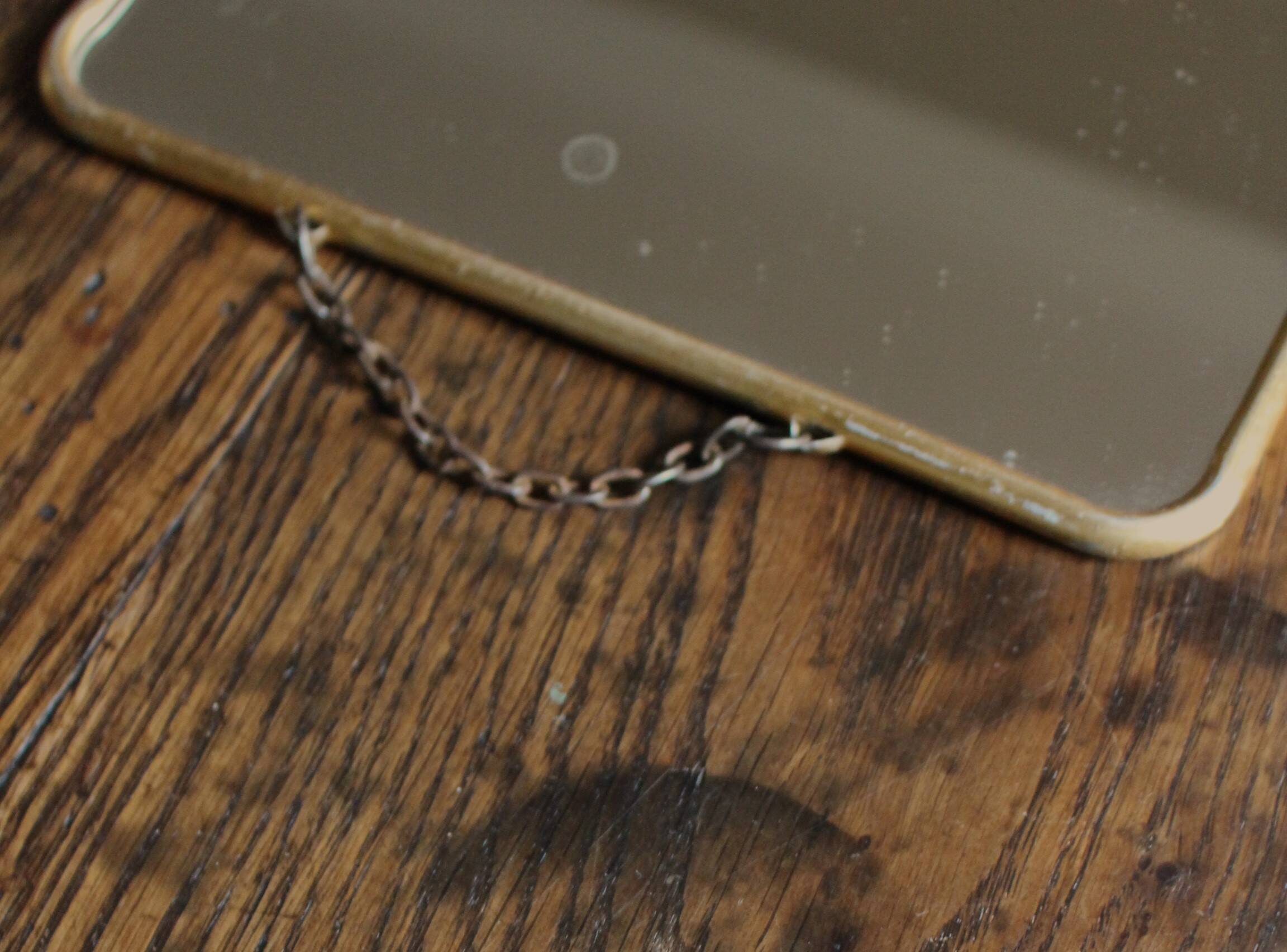 Simple barber mirror with gold metal chain