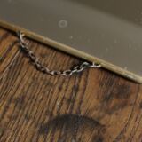 Simple barber mirror with gold metal chain