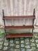 Vintage wall shelf made of dark solid wood from the 19th century.