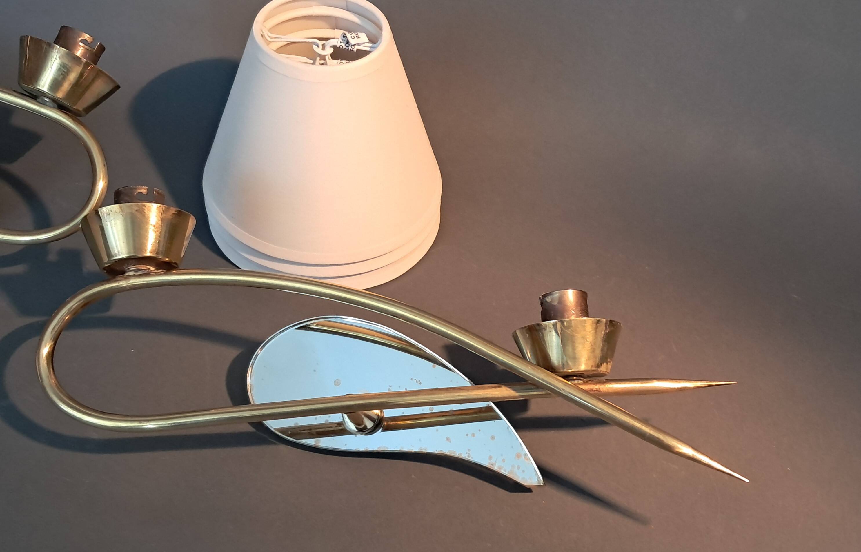 Pair of gilded brass and mirror wall lights, Circa 1960.