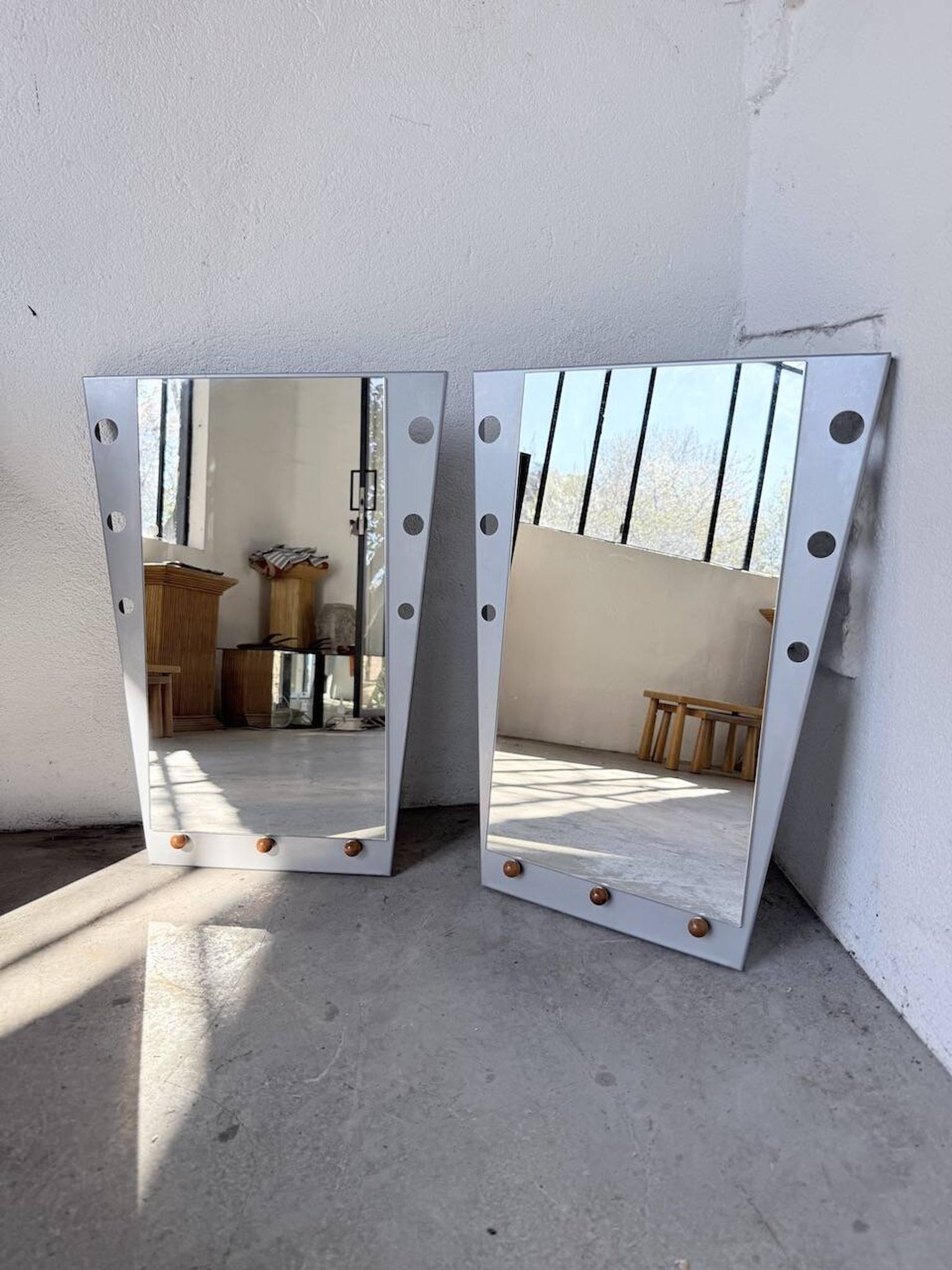 Pair of "Memphis" mirrors from the 80s in chrome and wood.
