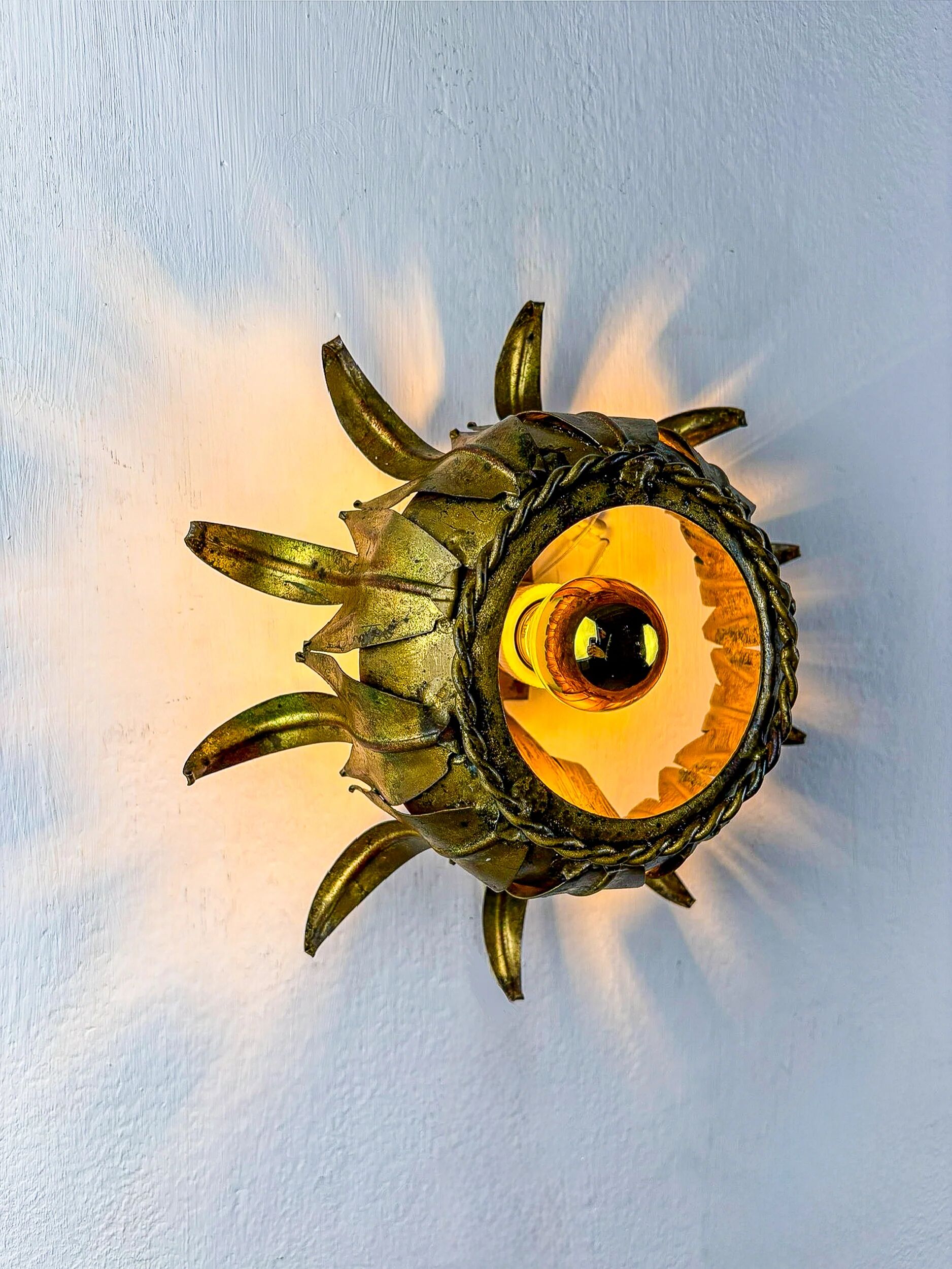 Sunburst ceiling light fixture or sconce in gilt wrought iron, Spain, 1960s