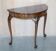 Console half-moon style Thomas Chippendale in flame mahogany.