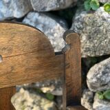 Pair of armchairs in stained wood and leather, 20th century