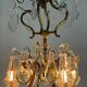 Bronze cage chandelier adorned with cut crystal pendants, 12 lights