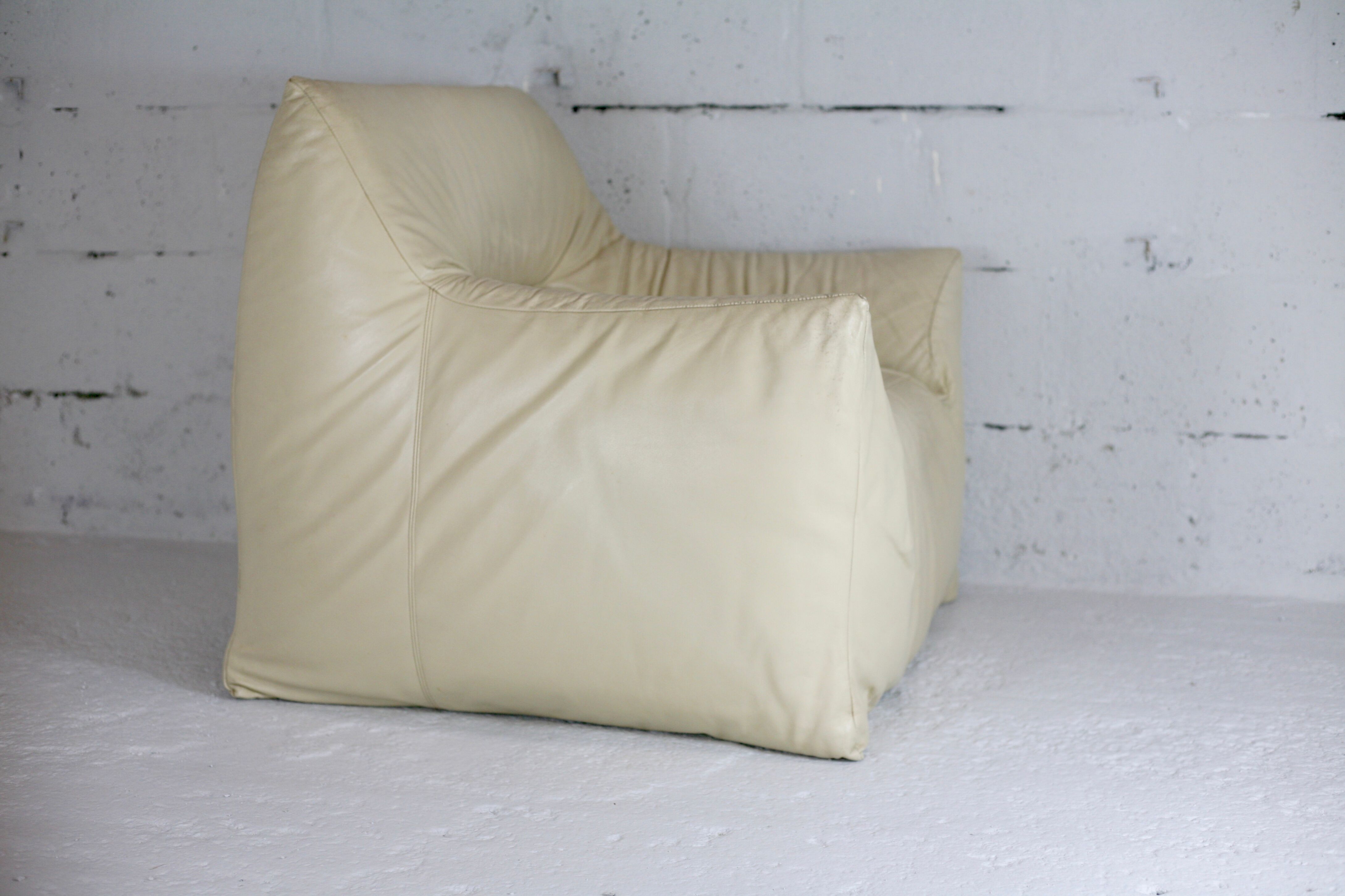 Leather armchair and cream-coloured foam, France , circa 1970