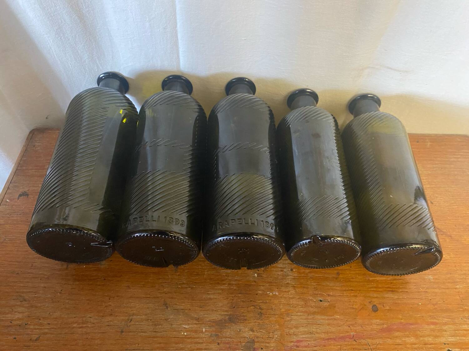 Set of 5 antique carapelli bottles, smoked and ribbed vintage glass