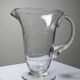 Antique glass pitcher with wheel engraving and floral decoration, Bohemia, early 20th century.