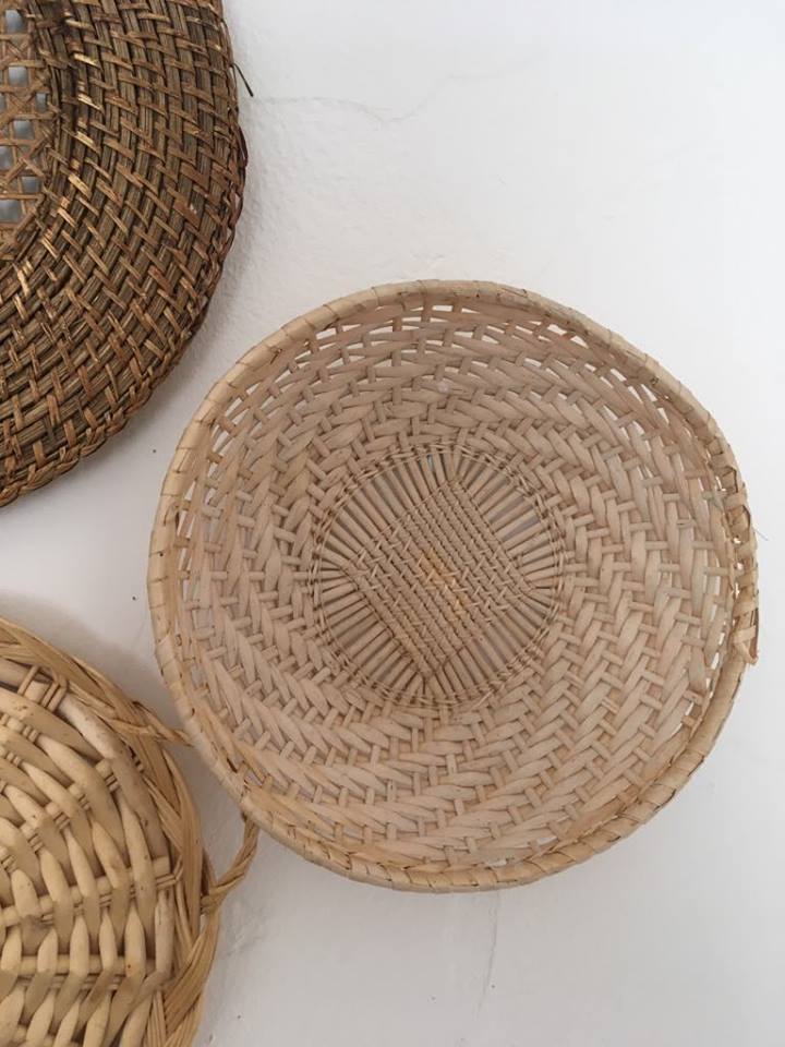 Wall composition of baskets and braided wicker trays