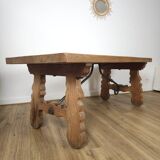 Rustic solid oak table with wrought iron, circa 1950.