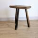 Antique tripod stool in patinated solid wood