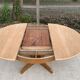 Round extendable Scandinavian dining table in Baumann style oak with central leg